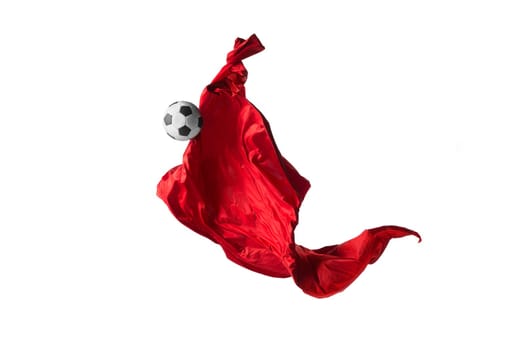 Soccer ball and Smooth elegant transparent red cloth isolated or separated on white studio background. Texture of flying fabric. red. Attributes of popular game. Concept of national flag color