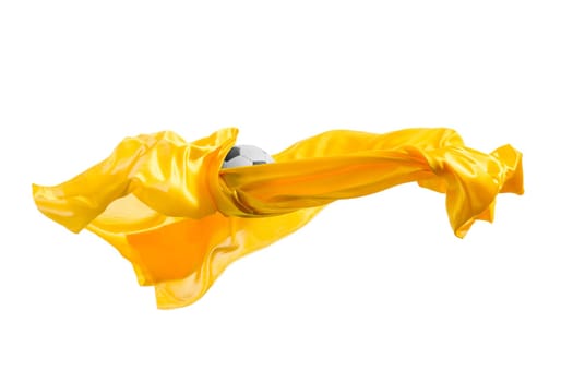 Soccer ball and Smooth elegant transparent yellow cloth isolated or separated on white studio background. Texture of flying fabric. yellow. Attributes of popular game. Concept of national flag color