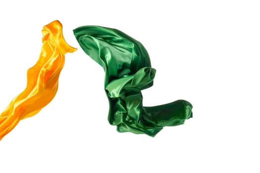 Smooth elegant transparent yellow, green cloth isolated or separated on white studio background. Texture of flying fabric.