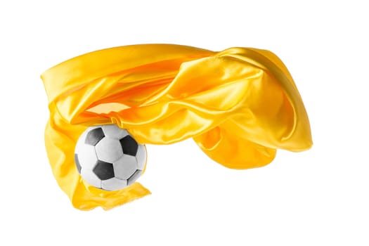 Soccer ball and Smooth elegant transparent yellow cloth isolated or separated on white studio background. Texture of flying fabric. yellow. Attributes of popular game. Concept of national flag color