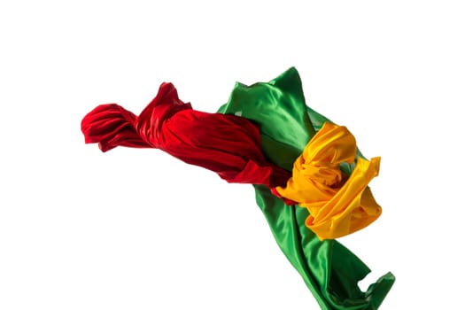 Smooth elegant transparent yellow, red, green cloth isolated or separated on white studio background. Texture of flying fabric.
