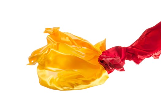 Smooth elegant transparent yellow, red, cloth isolated or separated on white studio background. Texture of flying fabric.
