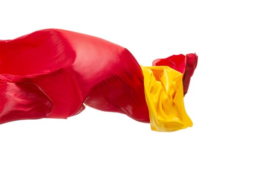 Smooth elegant transparent yellow, red, cloth isolated or separated on white studio background. Texture of flying fabric.