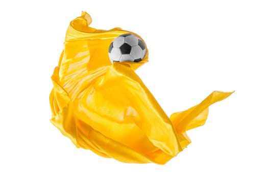 Soccer ball and Smooth elegant transparent yellow cloth isolated or separated on white studio background. Texture of flying fabric. yellow. Attributes of popular game. Concept of national flag color