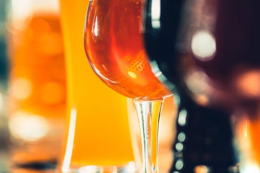 The beer taps in a pub. nobody. Selective focus. Alcohol concept. Vintage style. Beer craft. Bar table. Steel taps. Shiny taps. Glass of beer