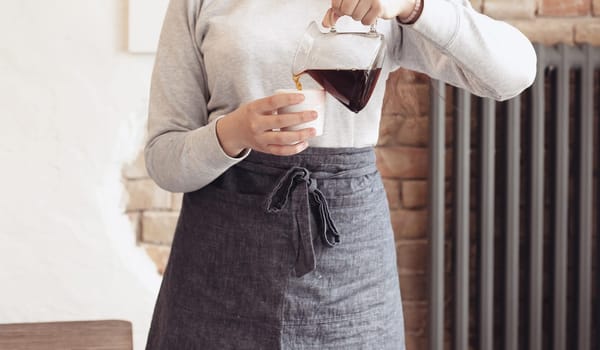 Barista, cafe, making coffee, preparation and service concept. Female hands at work. The hipster stile