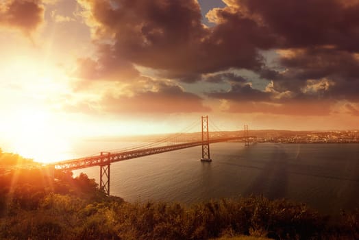 "25 de Abril"" bridge in Lisbon Portugal at sunset"