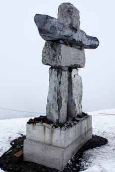 Inukshuk fog snow stone native sculpture symbol Canada cold