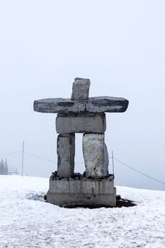 Inukshuk fog snow stone native sculpture symbol Canada