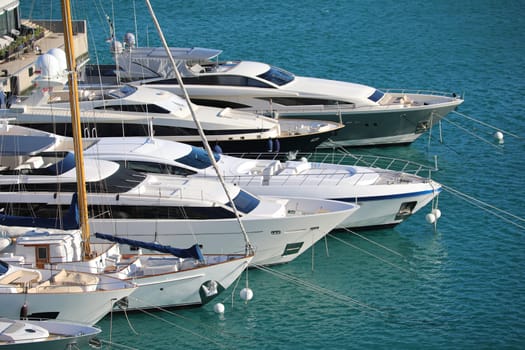 Monte-Carlo, Monaco - March 17, 2018: Luxurious Yachts And Megayachts Lined Up In The Monte-Carlo Harbour (Port Hercule), French Riviera