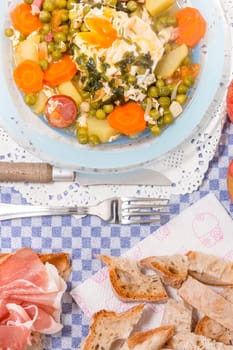 Traditional portuguese culinary meal of green peas with egg, potatoes and carrots.