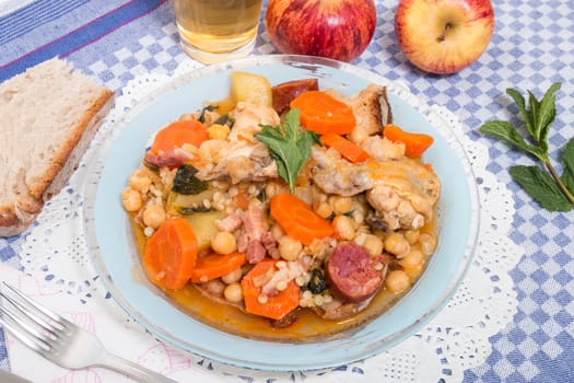 Traditional portuguese meal of Chickpeas with chicken, carrot and chorizo.