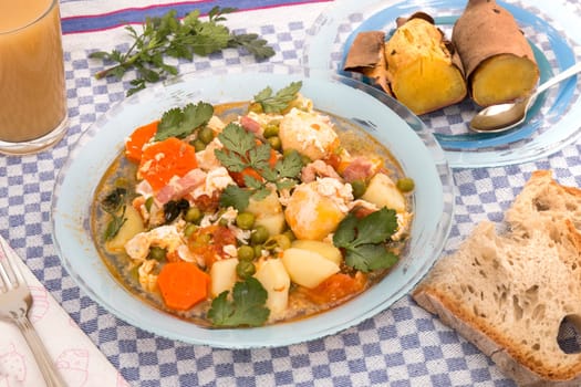 Traditional portuguese culinary meal of green peas with egg, potatoes and carrots.