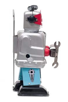 Vintage retro red face tin toy robot isolated on a white background.