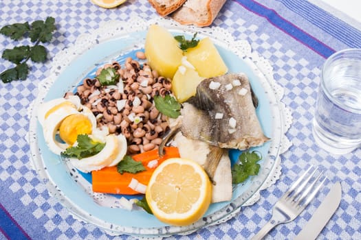 Traditional portuguese meal of cowpeas with cod fish, potato and egg.