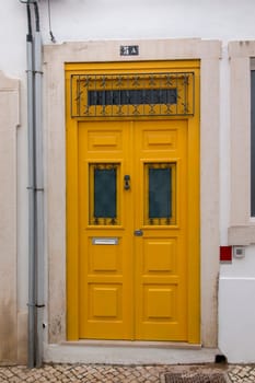 Typical wooden doors of Portuguese architecture in buildings.