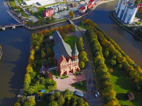 Aerial cityscape of Kaliningrad, Russia. Gothic cathedral in Kaliningrad city, formerly Koenigsberg, Germany. Beautiful view of Kant Island. The center of city in autumn. Birds eye panorama