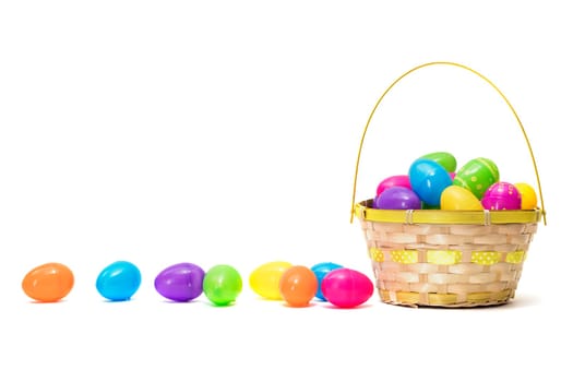 Easter eggs in basket isolated on white background