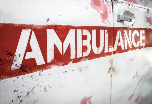 Masha and the Bear ambulance. Reproduction of the vehicle of the original animated series. Details of the characteristic rusty side panel. Bergamo, ITALY - August 28, 2017.