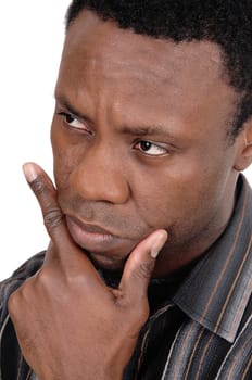 A Handsome African American man sitting in an portrait image with one.hand on his chin, isolated for white background.
