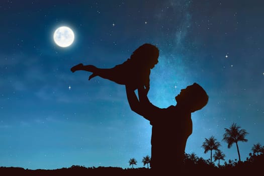 Silhouette of father and child having fun on the night