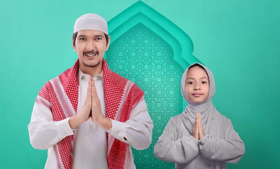 Portrait of asian muslim family praying together on the mosque