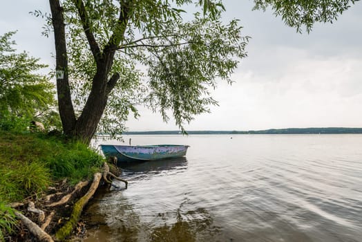 An old boat along the Kharkiv River, Ukraine