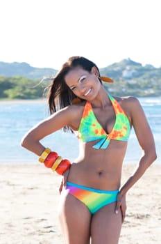 Beautiful and sexy girl posing and smiling at the beach in dominican republic