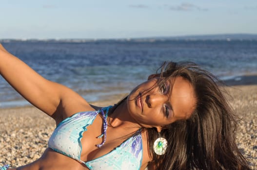 Beautiful and sexy girl posing at the beach in dominican republic dressing a bikini