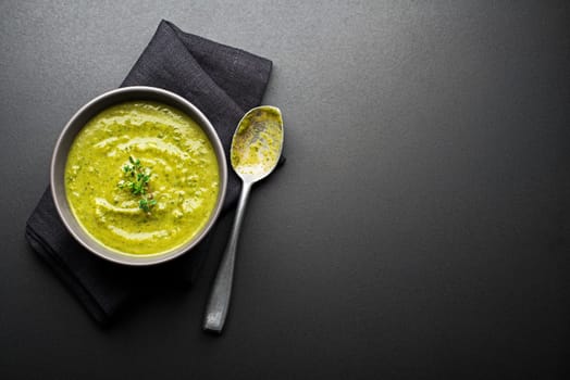 Fresh healthy vegetable green soup overhead shoot.
