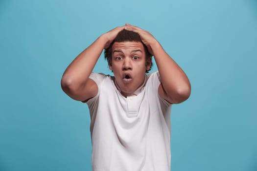 Wow. Attractive male half-length front portrait on pink studio backgroud. Young emotional surprised bearded man standing with open mouth. Human emotions, facial expression concept. Trendy colors