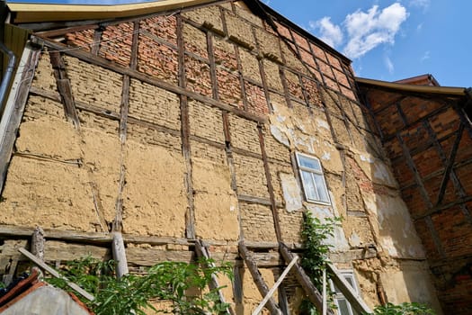dilapidated façade of an old half-timbered house in the old town of Quedlinburg