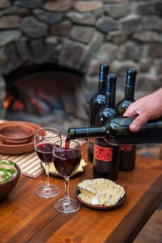 Pouring red wine into the glass