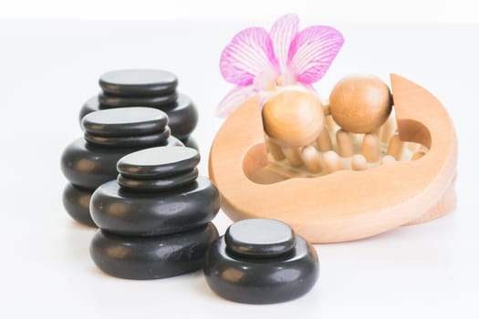 Spa therapy with hot stones, massage roller and cellulite massager