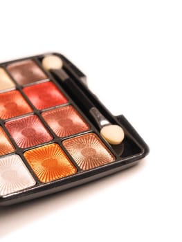 Close up of eye shadow on a white table, make up or fashion concept