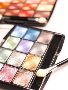 Close up of eye shadow on a white table, make up or fashion concept