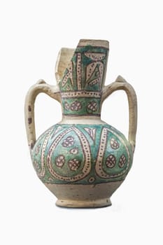 Jaen, Spain - December 29th, 2017: Moorish jar made of glazed clay technique found at Mengibar, Jaen. XII Century. Jaen Museum