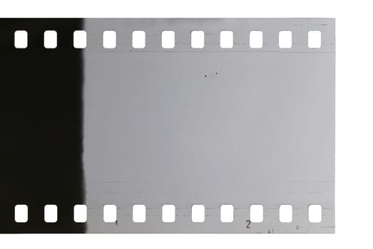 Strip of old celluloid film on white background