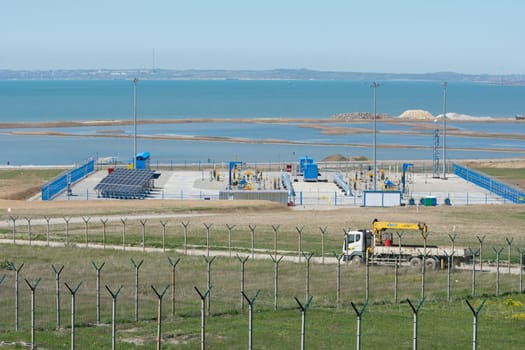 Taman, Russia - 15 April 2017: A platform with communications in front of the bridge that is being built across the Kerch Strait, from the tamani side, as of April 2017