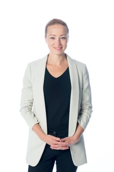 Portrait of casualy dressed,cheerful, beautiful, smart, young businesswoman in standing against white background.