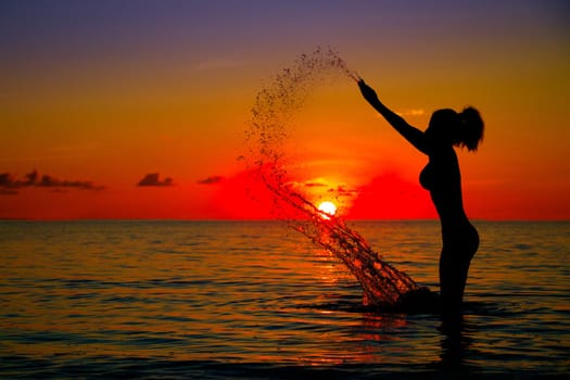 Woman silhouette on water