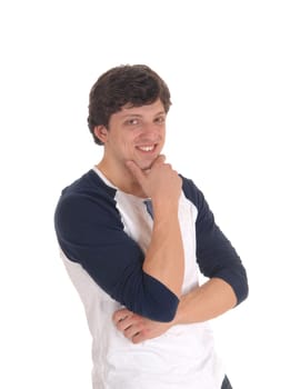 A close up image of a smiling young man with one hand on his chin, smiling.into the camera, isolated for white background.