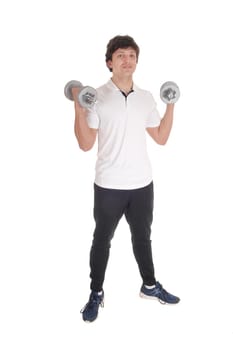 A lull body image of a young Caucasian man standing in exercise outfit holding.two dumbbells, isolated for white background.