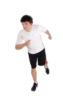 An handsome young man running in the studio in exercise outfit and running.shoes, isolated for white background.