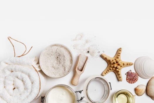 Spa theme objects on white paper background. Beauty threatment concept. Space for text. Flat lay.