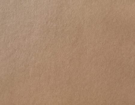 Wrapping paper texture. Kraft brown cardboard background.