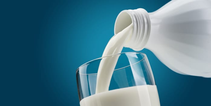 Pouring fresh milk from a bottle into a glass: dairy and nutrition