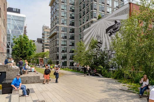 New York, NY, USA - June 8, 2015: The High Line Park in New York City, USA. It is a 2,33 km long elevated linear park, greenway and rail trail, created on a former New York Central Railroad spur on the west side of Manhattan.