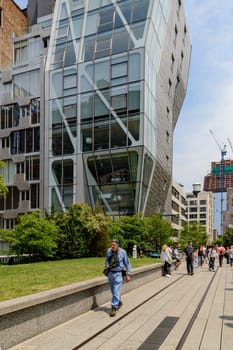 New York, NY, USA - June 8, 2015: The High Line Park in New York City, USA. It is a 2,33 km long elevated linear park, greenway and rail trail, created on a former New York Central Railroad spur on the west side of Manhattan.
