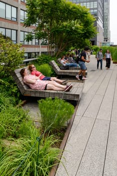 New York, NY, USA - June 8, 2015: The High Line Park in New York City, USA. It is a 2,33 km long elevated linear park, greenway and rail trail, created on a former New York Central Railroad spur on the west side of Manhattan.